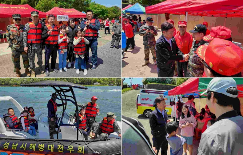 신상진 성남시장이 제103회 어린이날을 맞아 분당구 율동공원 호수에서 개최된 해병대 고무보트 승선 체험 행사에 참석해 현장을 찾은 시민들과 기념촬영을 하고 있다